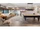 Entertaining game room showcases a pool table, comfortable seating and a large television for your enjoyment at 31 W Marlette Ave, Phoenix, AZ 85013
