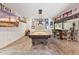 Spacious game room boasts a handsome pool table, wet bar and charming decor throughout the space at 31 W Marlette Ave, Phoenix, AZ 85013