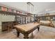 This game room offers a pool table, wet bar, fireplace and comfortable seating making it ideal for entertaining at 31 W Marlette Ave, Phoenix, AZ 85013