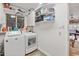 Functional laundry room featuring modern appliances and ample storage space at 31 W Marlette Ave, Phoenix, AZ 85013