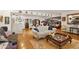 An open-concept living room includes hardwood floors, furniture, art and an open dining room at 31 W Marlette Ave, Phoenix, AZ 85013
