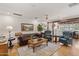 Comfortable living room with hardwood floors, stylish seating, and a classic wood paneled wall at 31 W Marlette Ave, Phoenix, AZ 85013