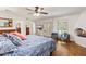 Bedroom with a fireplace, wood floors, blue accents, and access to a patio at 31 W Marlette Ave, Phoenix, AZ 85013