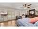 Bedroom with a fireplace, wood floors, blue accents, and access to a patio at 31 W Marlette Ave, Phoenix, AZ 85013