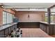 Covered outdoor bar with brick walls, tile floors, and ample counter space for entertaining guests at 31 W Marlette Ave, Phoenix, AZ 85013