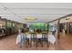 Charming outdoor dining area with string lights, a long table, and a convenient wet bar for entertaining at 31 W Marlette Ave, Phoenix, AZ 85013