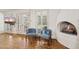 Cozy sitting area featuring a fireplace, a TV, and views of the landscaped yard at 31 W Marlette Ave, Phoenix, AZ 85013