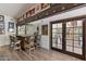 A rustic wet bar showcases custom woodwork, decorative glassware, and easy access to the outdoor dining area at 31 W Marlette Ave, Phoenix, AZ 85013