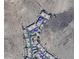 Aerial view of an apartment complex surrounded by desert landscape with unit prices marked at 3236 E Chandler Blvd # 2028, Phoenix, AZ 85048