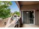 Balcony view of the community pool and walkway, creating a serene outdoor living space at 3236 E Chandler Blvd # 2028, Phoenix, AZ 85048