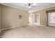 Bedroom with neutral walls, carpet, ceiling fan and adjoining bathroom at 3236 E Chandler Blvd # 2028, Phoenix, AZ 85048