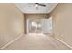 Spacious carpeted bedroom with a sliding door leading to a balcony at 3236 E Chandler Blvd # 2028, Phoenix, AZ 85048