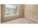 Cozy bedroom featuring a window with scenic views and neutral carpeting at 3236 E Chandler Blvd # 2028, Phoenix, AZ 85048