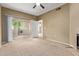 Carpeted bedroom with patio access, ceiling fan and adjoining door at 3236 E Chandler Blvd # 2028, Phoenix, AZ 85048