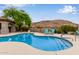 Community pool features desert landscaping, mountain views and lounge seating at 3236 E Chandler Blvd # 2028, Phoenix, AZ 85048