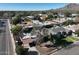 Scenic aerial view of a residential neighborhood with mountain views and mature landscaping at 3404 N Kachina Ln, Scottsdale, AZ 85251