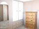 Bedroom features built-in closet space and a wooden dresser, offering ample storage at 345 S 58Th St # 10, Mesa, AZ 85206