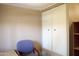 Bedroom includes built-in closet with ample space, complemented by neutral decor at 345 S 58Th St # 10, Mesa, AZ 85206