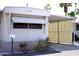 Charming single-level home featuring a covered carport and well-maintained landscaping at 345 S 58Th St # 10, Mesa, AZ 85206