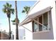 Exterior view of home featuring awning-covered windows and palm trees at 345 S 58Th St # 10, Mesa, AZ 85206