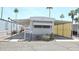 Charming mobile home featuring covered parking and well-maintained landscaping in a vibrant community at 345 S 58Th St # 10, Mesa, AZ 85206