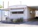Home exterior featuring an awning, xeriscaping, and a charming mailbox, perfect for curb appeal at 345 S 58Th St # 10, Mesa, AZ 85206