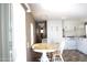 Bright kitchen features a round table, white cabinets, and an efficient gas stove at 345 S 58Th St # 10, Mesa, AZ 85206