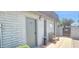 Close-up of the laundry room entrance, with seating and external amenities at 345 S 58Th St # 10, Mesa, AZ 85206