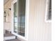 Exterior sliding glass door with a small step off a covered patio area at 345 S 58Th St # 10, Mesa, AZ 85206