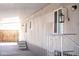 Side patio with covered area featuring steps, railing and an exterior light fixture at 345 S 58Th St # 10, Mesa, AZ 85206