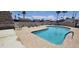 Community pool with lounge chairs, tables, and clear blue water perfect for a refreshing swim on a hot day at 345 S 58Th St # 10, Mesa, AZ 85206