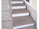 Exterior view of carpeted steps and railing leading up to the home at 345 S 58Th St # 10, Mesa, AZ 85206