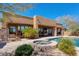 Expansive backyard featuring a refreshing pool, spa, lush greenery, and a covered patio for relaxation at 35195 N 98Th St # 85, Scottsdale, AZ 85262
