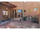Charming front entrance featuring a fountain, wooden door, and bay windows at 35195 N 98Th St # 85, Scottsdale, AZ 85262