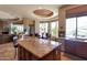 Open kitchen with granite counters, custom cabinets, a central island, and an adjacent dining area at 35195 N 98Th St # 85, Scottsdale, AZ 85262