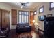 Cozy living room featuring a ceiling fan, wood floors, and ample natural light at 35195 N 98Th St # 85, Scottsdale, AZ 85262