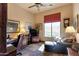 Cozy home office with a comfortable seating area, a desk, natural light, and stylish decor at 35195 N 98Th St # 85, Scottsdale, AZ 85262