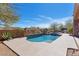 Stunning private pool surrounded by lush desert landscaping with a built-in barbecue area, perfect for outdoor entertaining at 35195 N 98Th St # 85, Scottsdale, AZ 85262