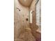 Tiled shower with dual shower heads, corner bench, and glass block window feature at 35195 N 98Th St # 85, Scottsdale, AZ 85262