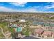 Beautiful aerial view of the community featuring a pool, tennis courts, and a well-maintained golf course at 3640 E Torrey Pines Ln, Chandler, AZ 85249