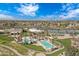 Aerial view of the pool, aquatic center, and palm trees within the community at 3640 E Torrey Pines Ln, Chandler, AZ 85249