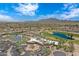 Community aerial shot highlighting the recreational facilities including the pool, tennis courts, and meticulously landscaped grounds at 3640 E Torrey Pines Ln, Chandler, AZ 85249
