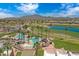 A picturesque community aerial view of a well-maintained pool area and golf course against mountain backdrop at 3640 E Torrey Pines Ln, Chandler, AZ 85249