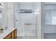 Bright bathroom featuring a glass-enclosed shower with built-in seating at 3640 E Torrey Pines Ln, Chandler, AZ 85249