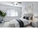 Serene bedroom featuring a comfortable bed, neutral colors, ceiling fan, and soft textures for a relaxing retreat at 3640 E Torrey Pines Ln, Chandler, AZ 85249