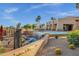 Beautiful community pool with waterfalls and palm trees, creating a resort-like ambiance for residents to enjoy at 3640 E Torrey Pines Ln, Chandler, AZ 85249