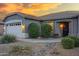 Attractive single-story home showcasing a two-car garage, well-manicured desert landscaping and tile roof at 3640 E Torrey Pines Ln, Chandler, AZ 85249