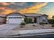 Charming home featuring a two-car garage, neutral paint, desert landscaping and a tile roof at 3640 E Torrey Pines Ln, Chandler, AZ 85249