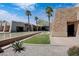 Modern stone exterior with a beautiful water feature and meticulously kept landscaping at 3640 E Torrey Pines Ln, Chandler, AZ 85249