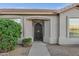 Home entrance featuring desert landscaping with decorative rock and mature green shrubs at 3640 E Torrey Pines Ln, Chandler, AZ 85249